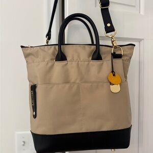 R.Riveter Otto style bag.  Cream nylon and black leather.
Well made in USA